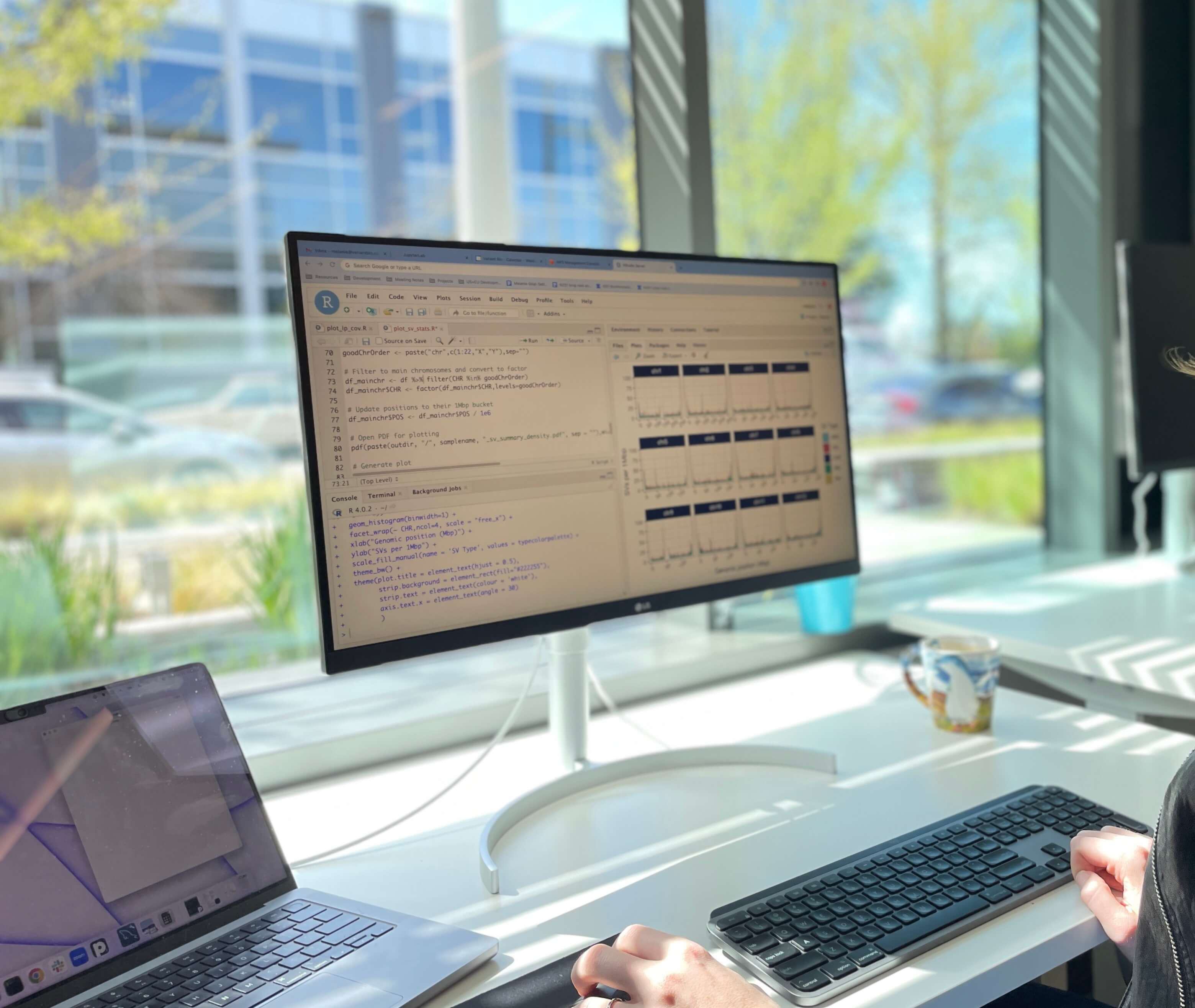 Someone coding on a monitor at the Variant Bio Seattle office