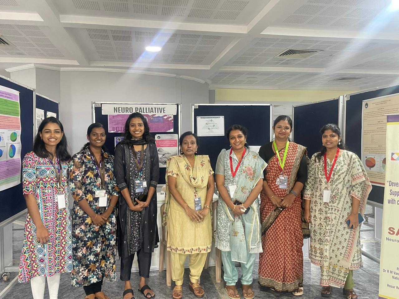 Seven women in a line, looking at the camera