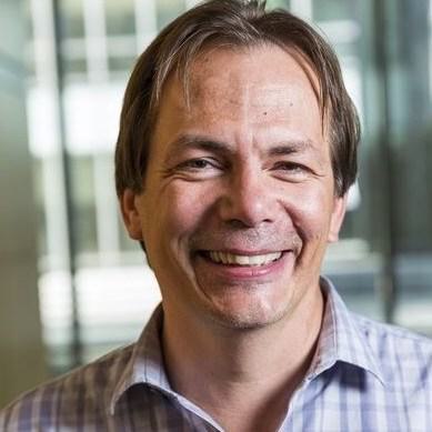 A headshot of Evan Eichler