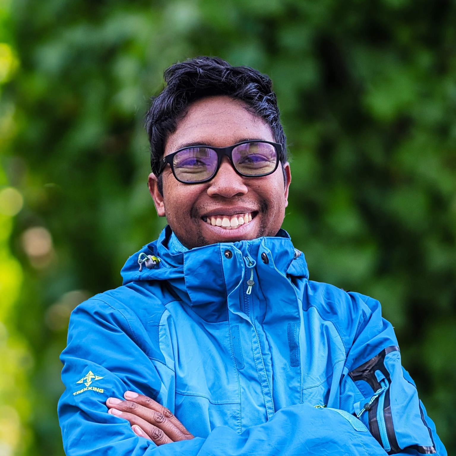 Headshot of a man, smiling