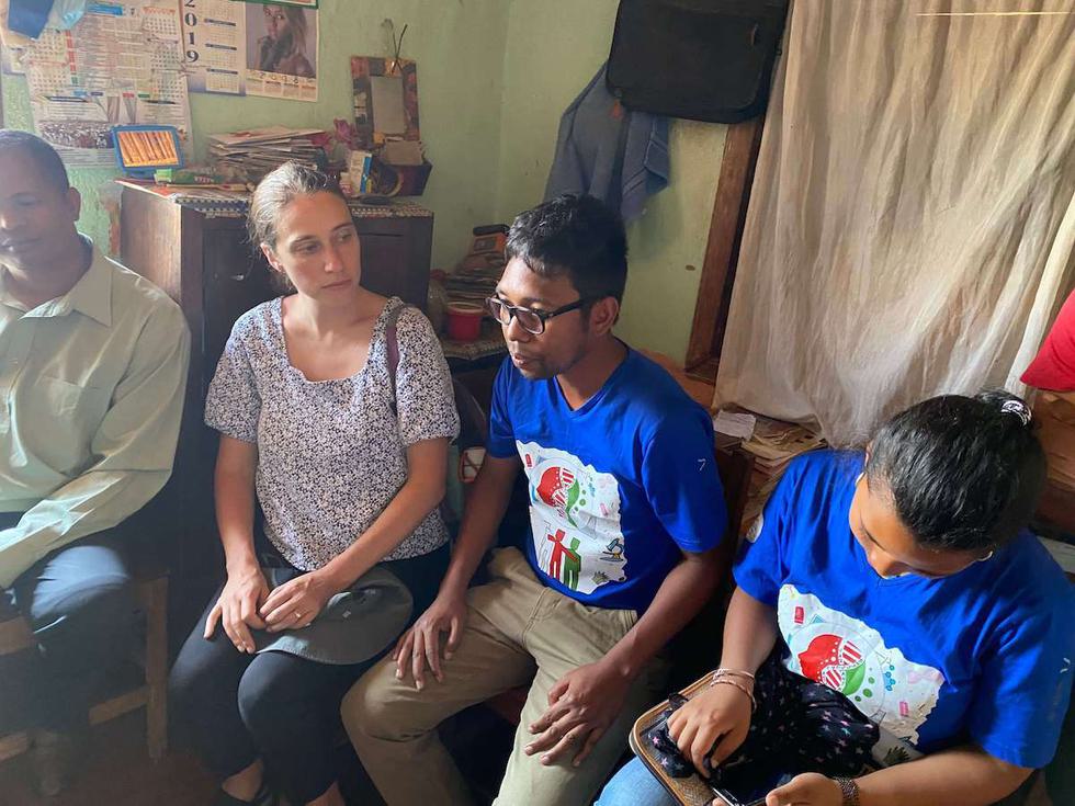 Rindra, a Variant Bio Fellow, speaking to a partner community alongside a Variant Bio team member